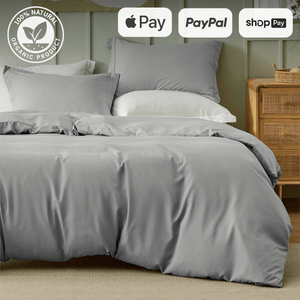 Luxurious gray organic bedding set on neatly made bed with payment options of Apple Pay, PayPal, and Shop Pay shown.