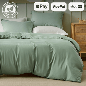 Sage green organic bedding set on a neatly made bed with payment options Apple Pay, PayPal, and Shop Pay displayed.