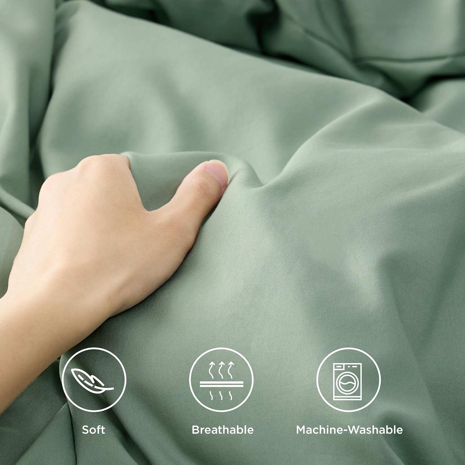 Hand touching soft, breathable, machine-washable fabric in green color with icons indicating softness, breathability, and washability.