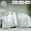 Organic white comforter on bed with multiple pillows, featuring payment options Apple Pay, PayPal, and Shop Pay.