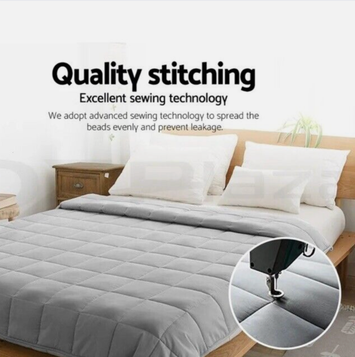 High-quality stitching on grey quilt with advanced sewing technology to ensure even bead spread and prevent leakage.