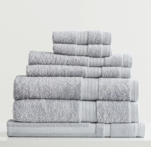 Stack of folded gray towels on a white background