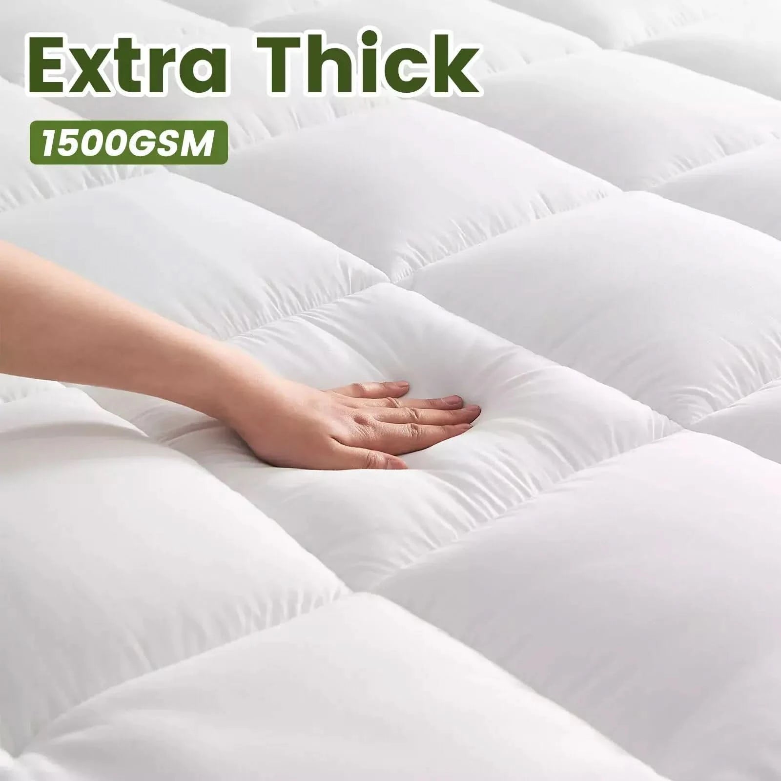 Close-up of a hand pressing into an extra-thick white quilted mattress topper, showcasing its plush cushioning and softness for enhanced comfort